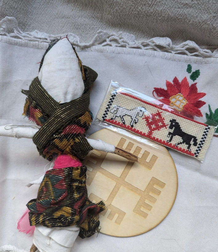 A motanka doll, a Weless horse embroidery, czernobo Białobog and Hands of God symbol
